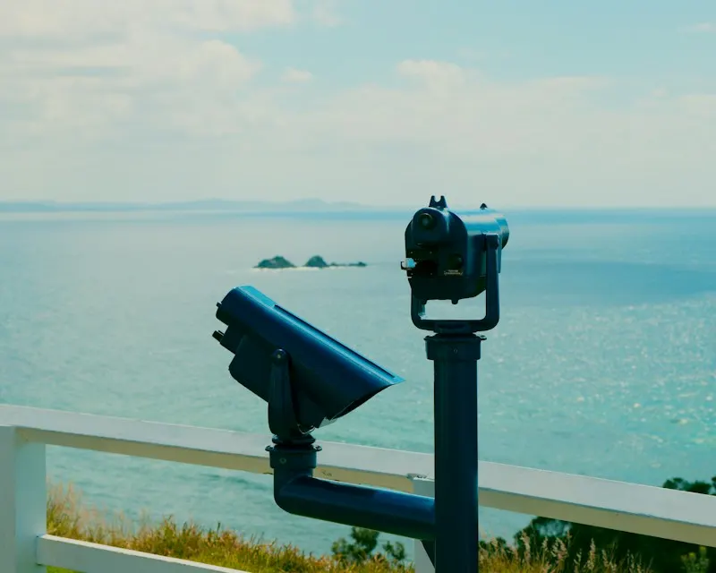 Viewing binoculars at a Byron Bay lookout, with Julian Rocks offshore